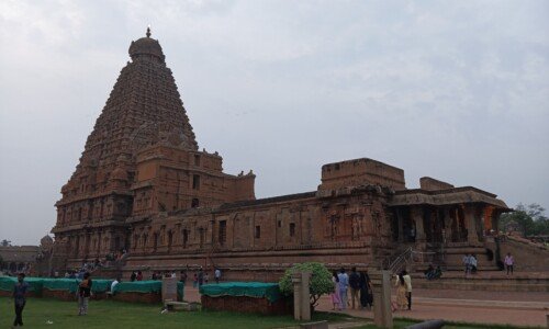 Brihadeshwara Temple in Tanjavur with cloudy sky background.