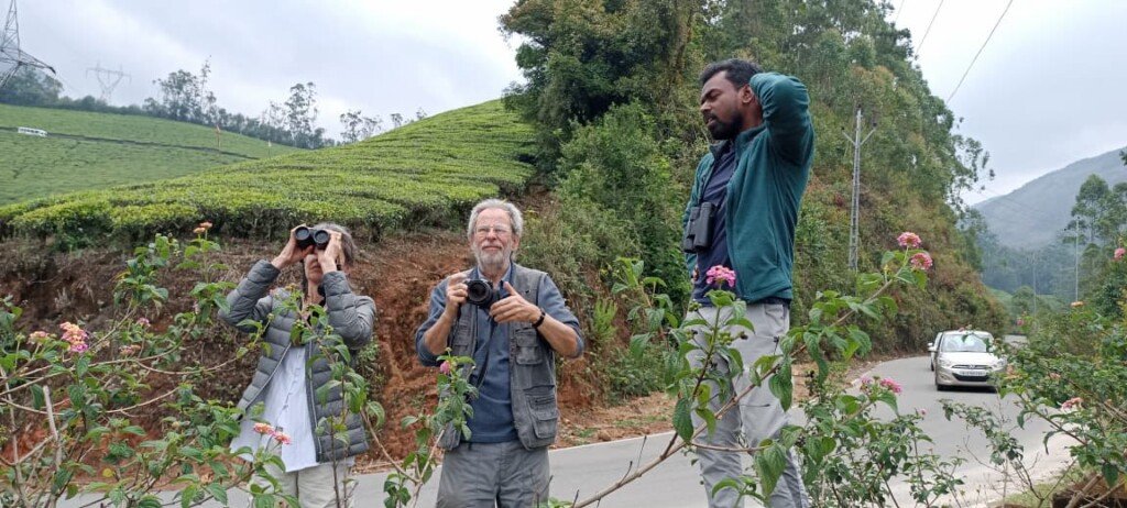 Diane and Nick Carter, happy guests of Tropic Trails, enjoying their birding tour in the scenic hills of Munnar, Kerala, India