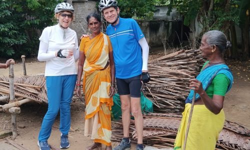 Artisan weaving intricate patterns with coconut leaves in Kumbakonam, South India.