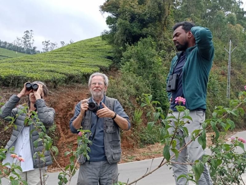 Diane and Nick Carter, happy guests of Tropic Trails, enjoying their birding tour in the scenic hills of Munnar, Kerala, India